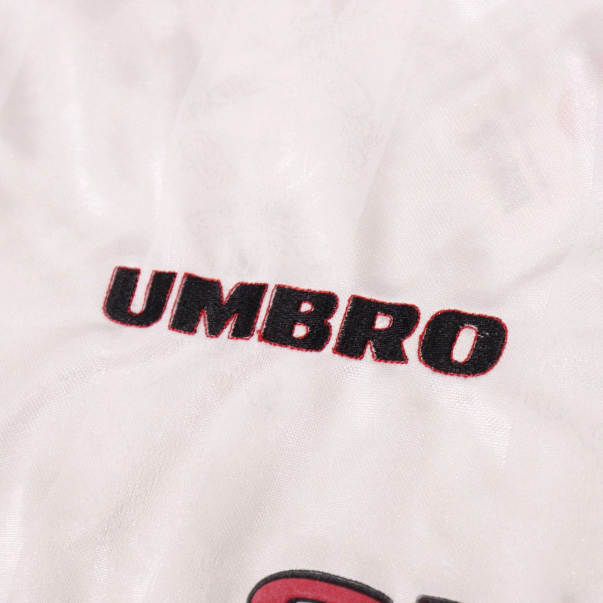 Close-up of the Umbro logo embroidered on the chest