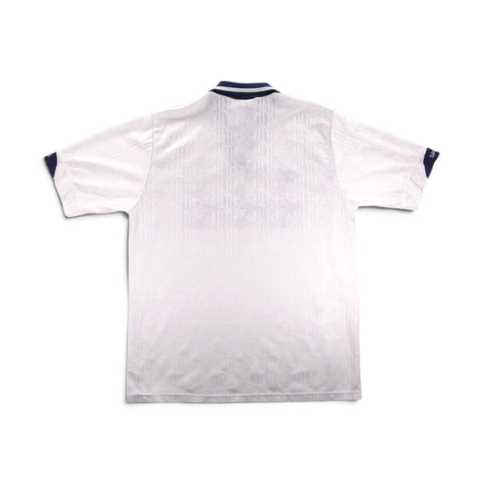 Back of a Tottenham Hotspur home shirt showing jacquard pattern and navy trim