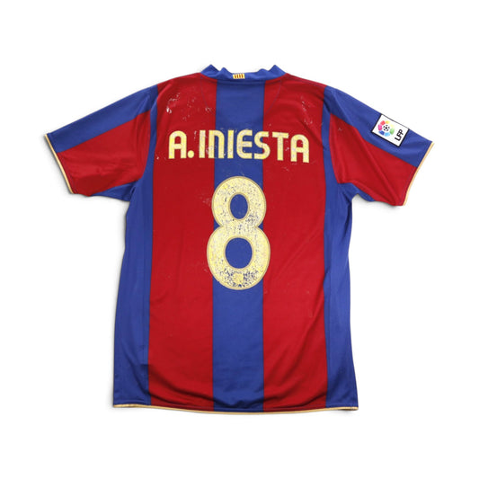 Barcelona home shirt back with A. Iniesta and number 8