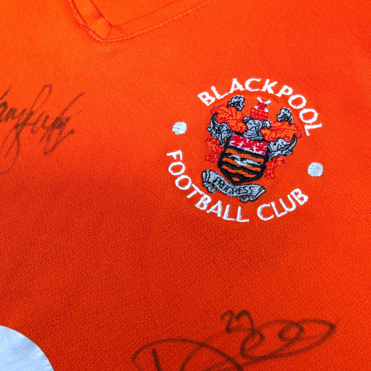 Close-up of the embroidered Blackpool Football Club crest on the chest