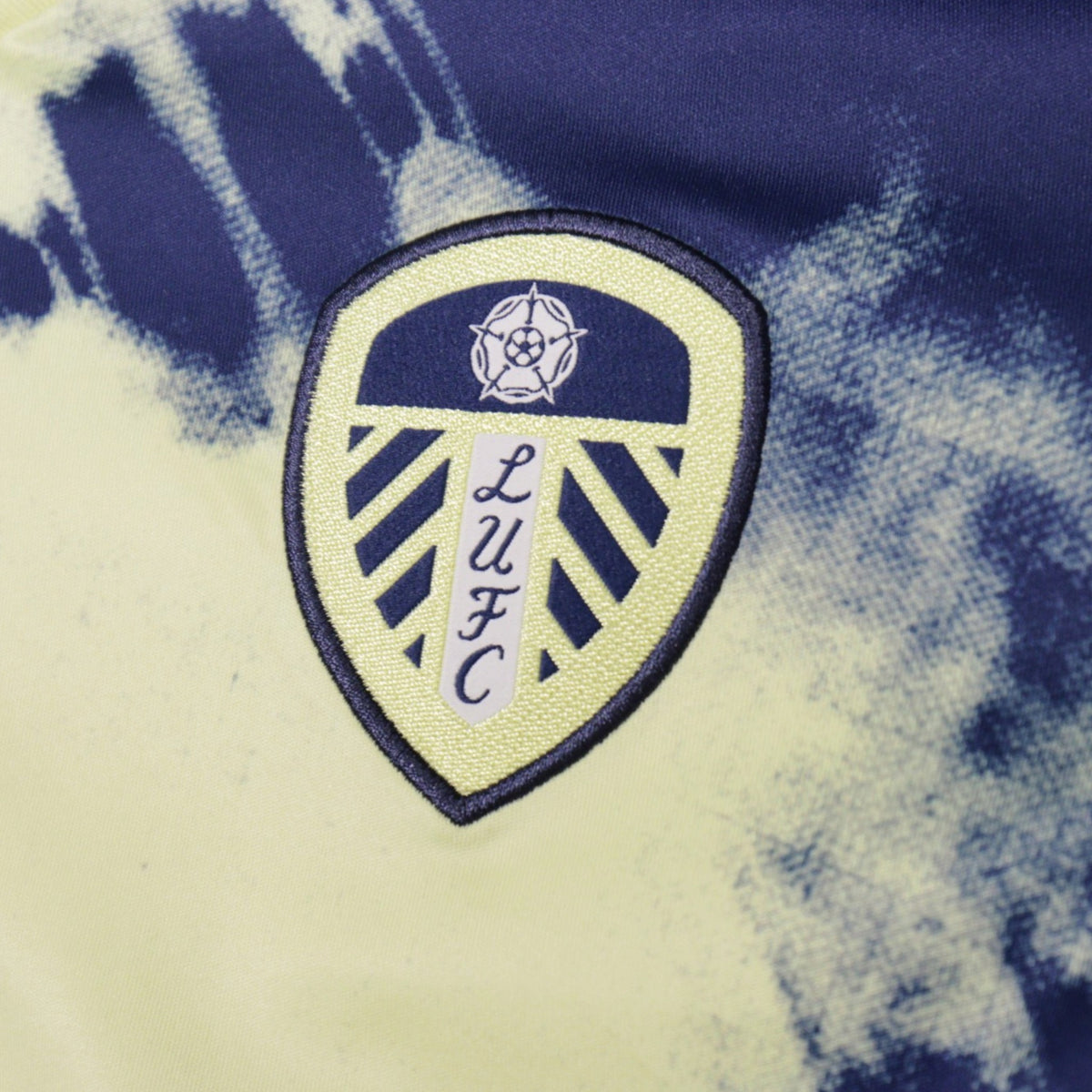 Close-up of embroidered Leeds United crest on away shirt