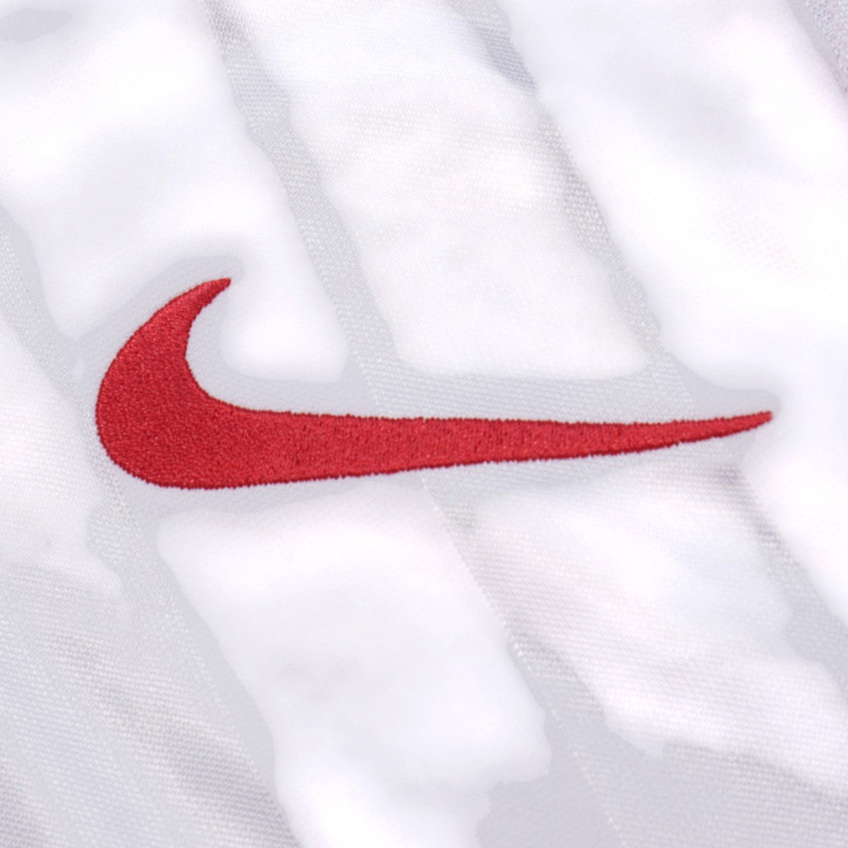 Close-up of the Nike swoosh logo on the shirt