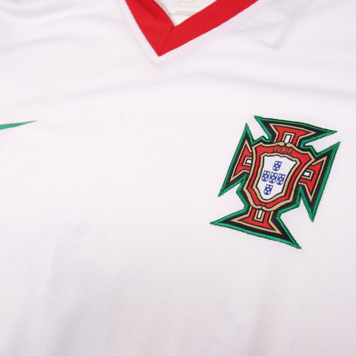 Close-up of the Portugal crest and Nike swoosh on the chest