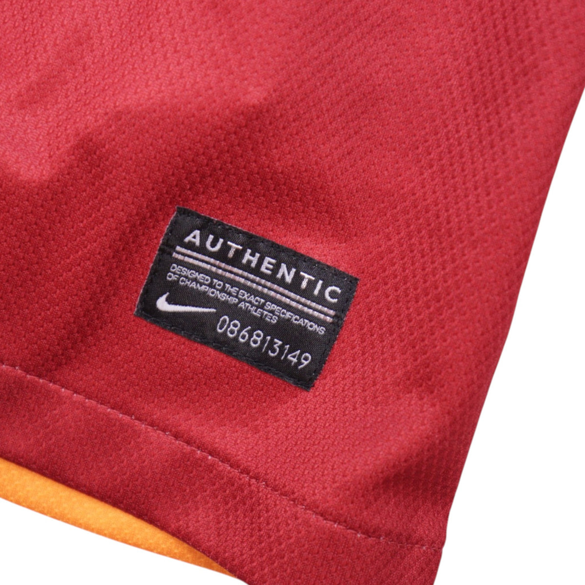 Close-up of Nike Authentic label with product code on inside hem