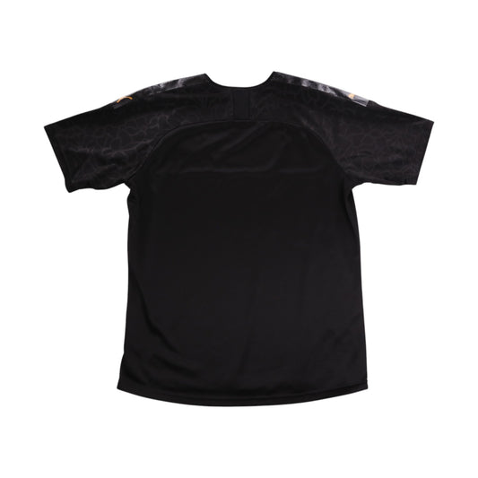Back of black Olympique Marseille third shirt showing plain rear and camouflage-pattern sleeves