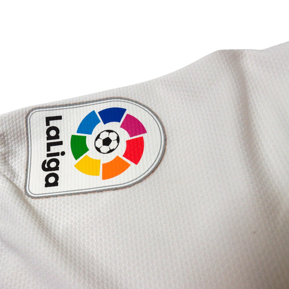 Close-up of LaLiga sleeve badge on Real Madrid shirt