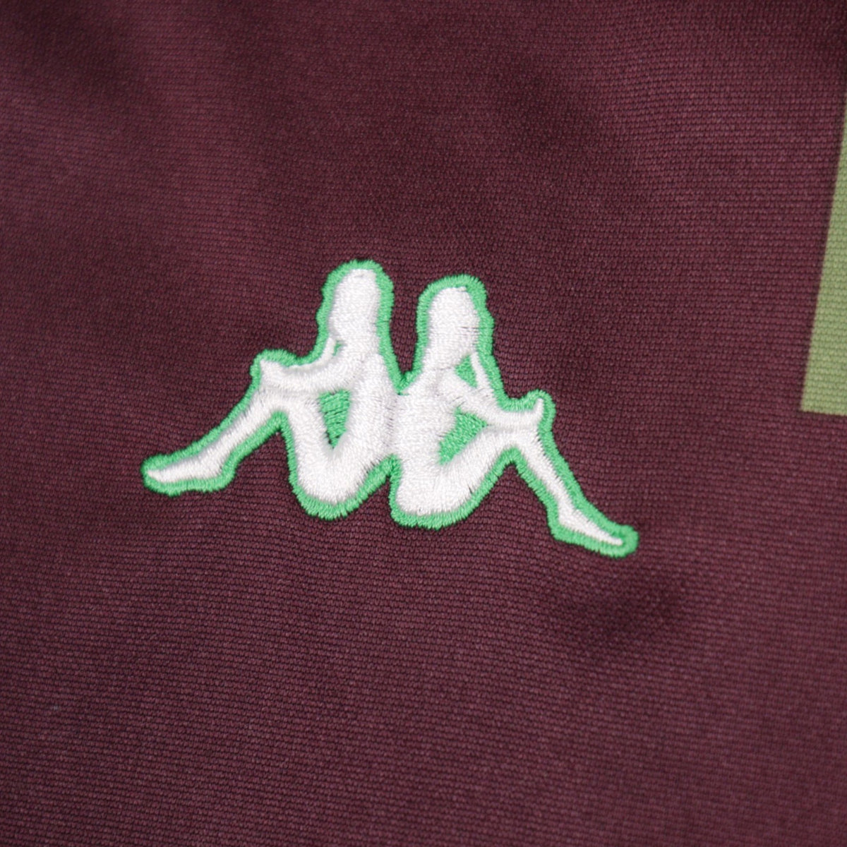 Close-up of the Kappa Omini logo on the chest