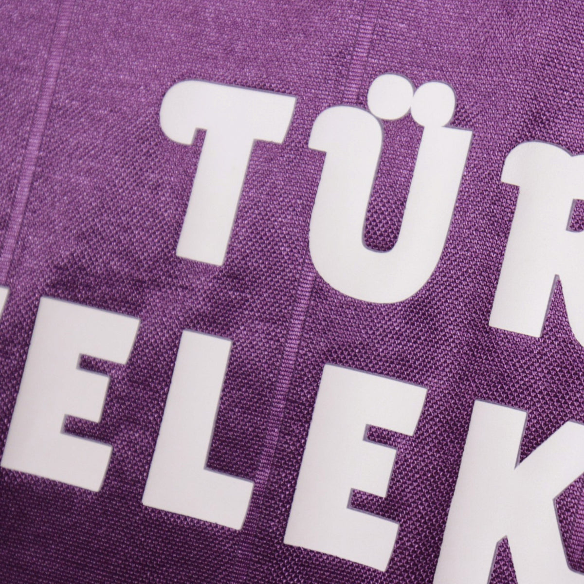 Close-up of the Türk Telekom sponsor print on the shirt front