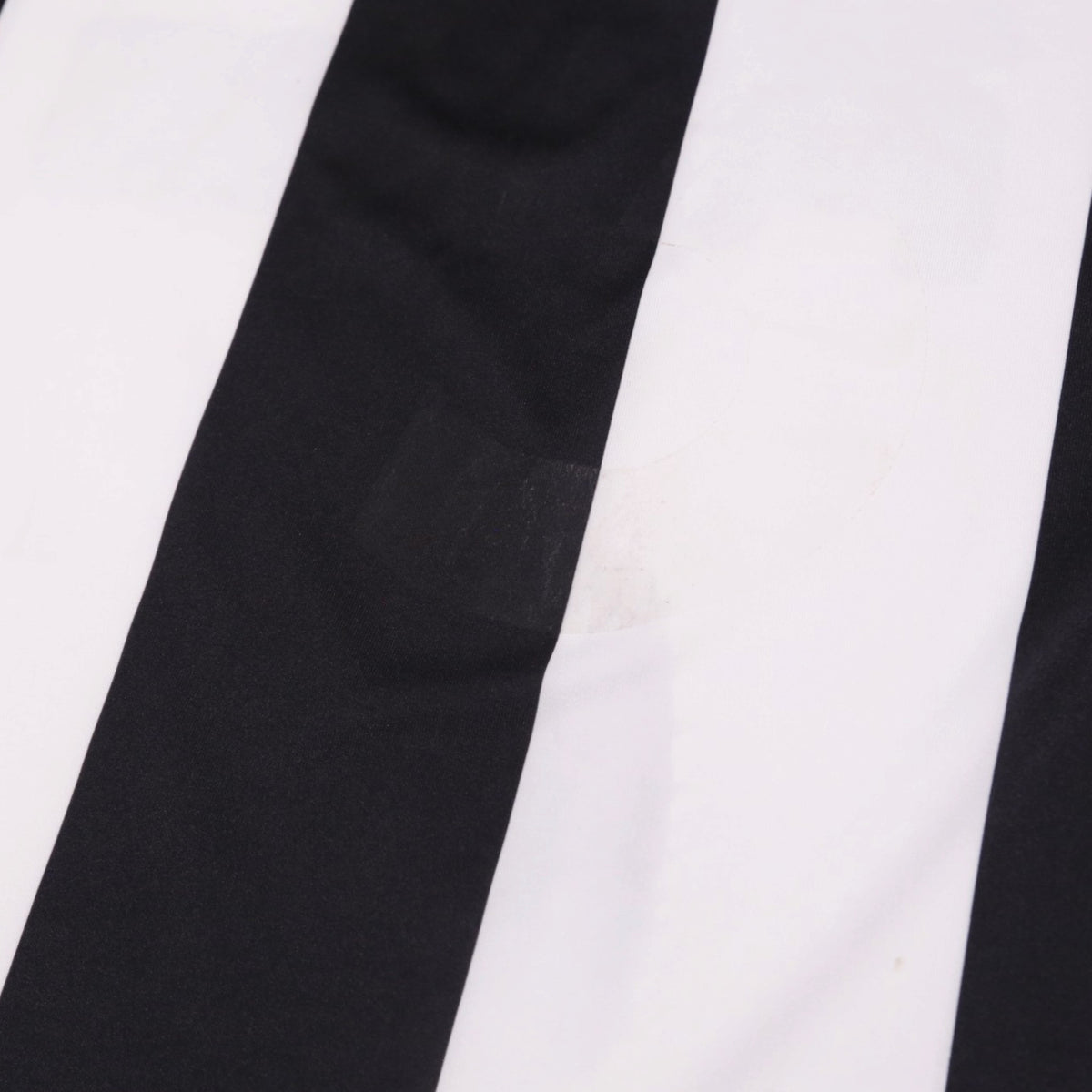 Close-up of the black and white striped fabric showing a faint mark