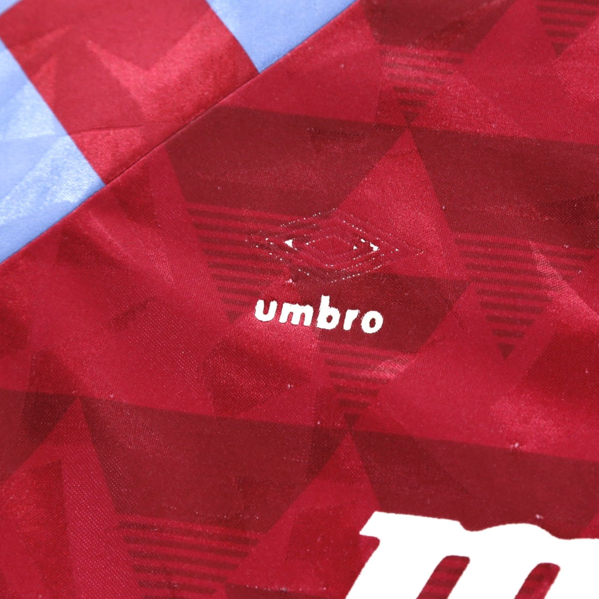 Close-up of the Umbro logo printed into the fabric