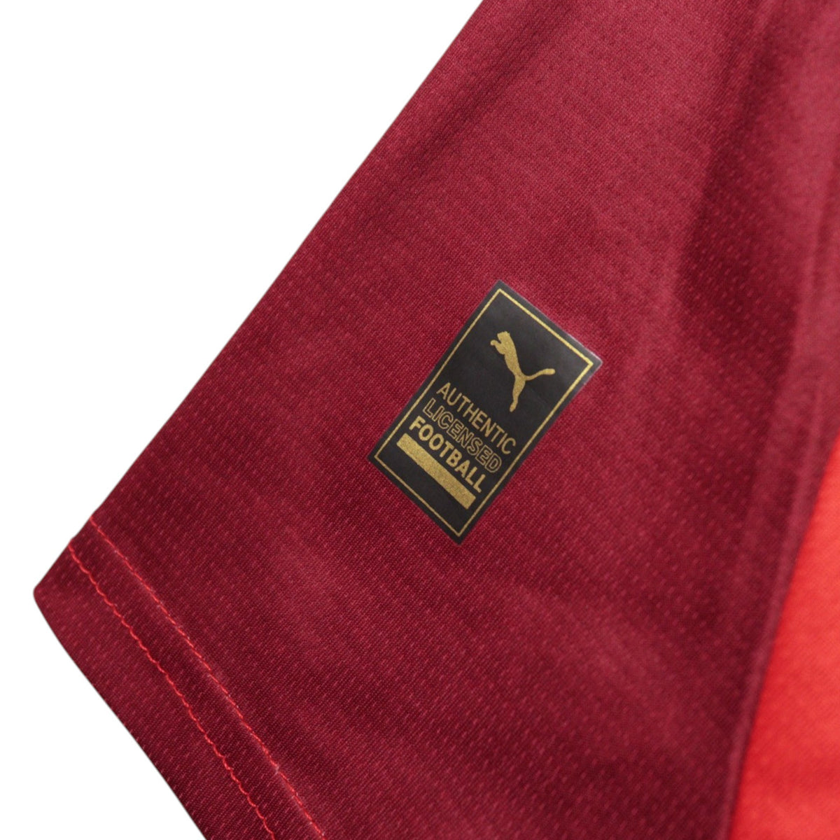 Close-up of the Authentic Licensed Football hangtag on the hem