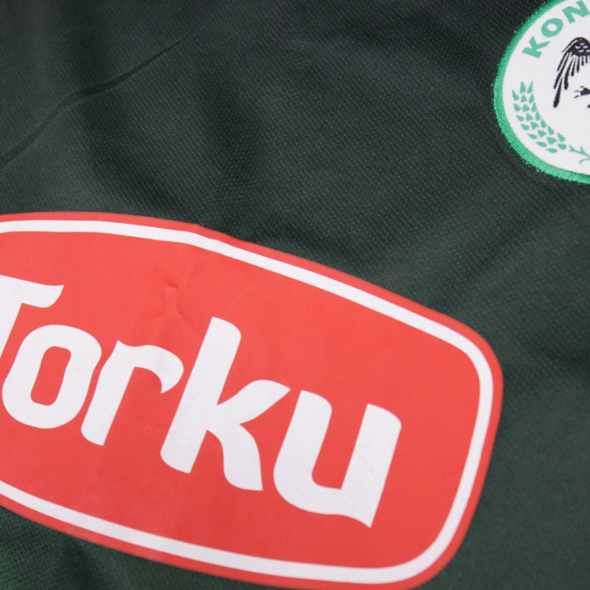 Close-up detail of Torku sponsor and Konyaspor crest on shirt front