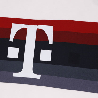 Close-up of the Telekom sponsor logo on the chest