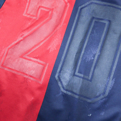 Close-up of the faded number 20 on the back of the shirt