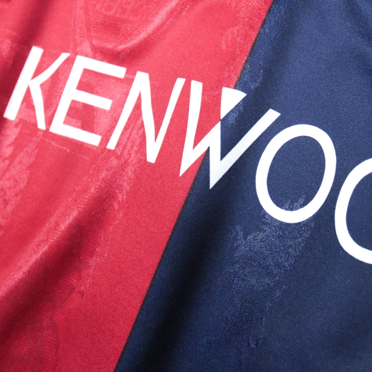 Close-up of the Kenwood sponsor print on the chest