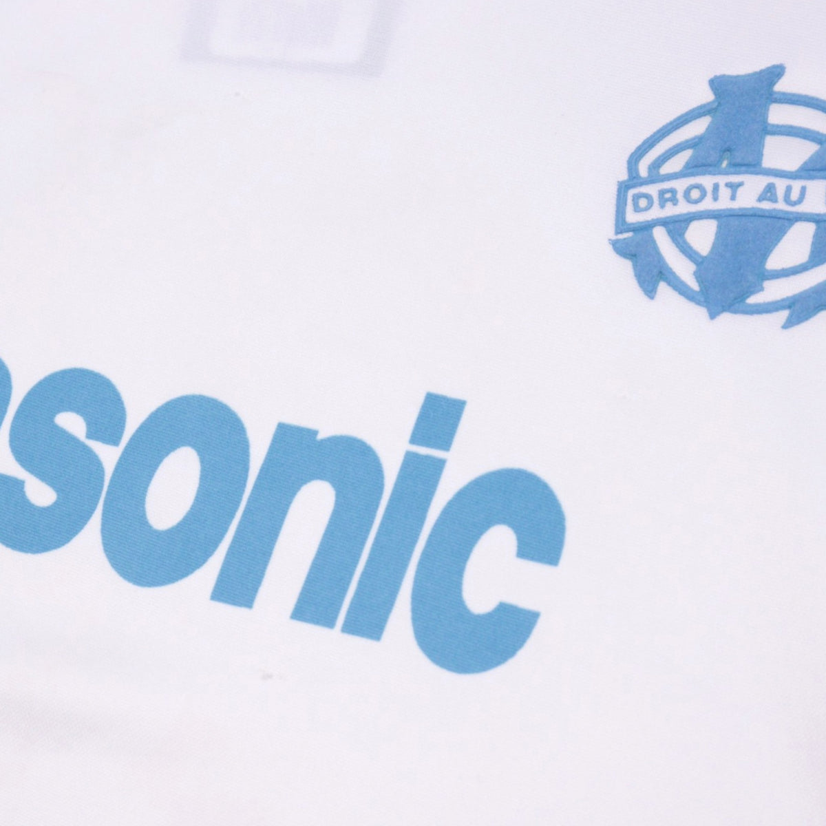 Close-up of the Panasonic sponsor print and Marseille crest