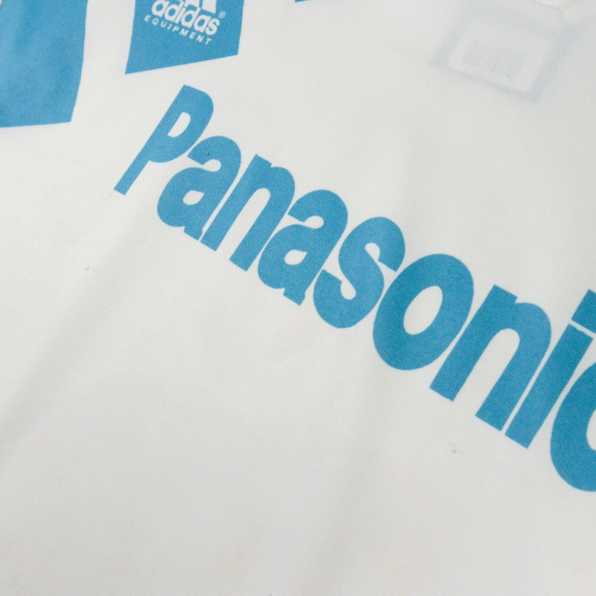 Close-up of the Panasonic sponsor print on the chest