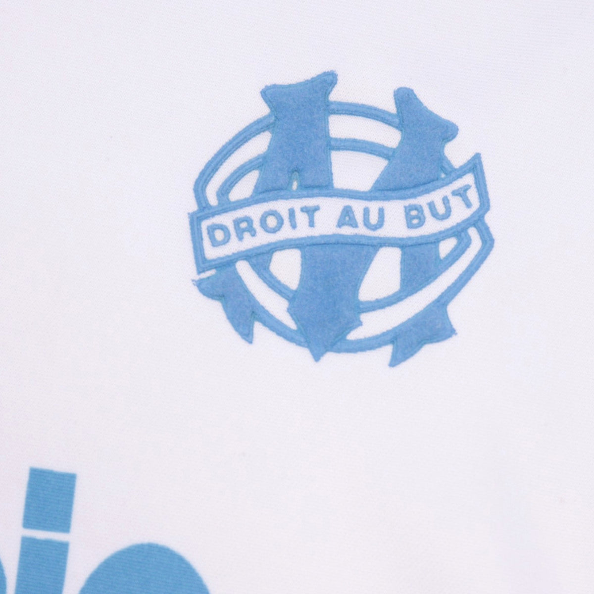 Close-up of the Olympique Marseille crest with Droit au But motto