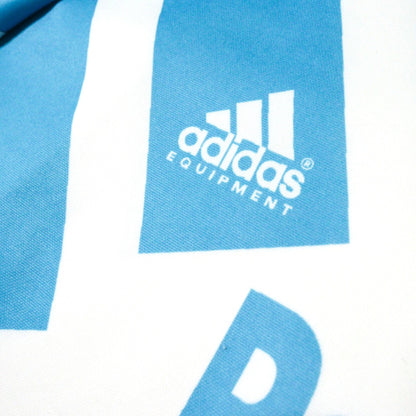 Close-up of the adidas Equipment logo on the shoulder panel