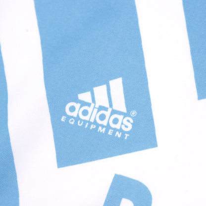 Close-up of the adidas Equipment logo on the shirt panel