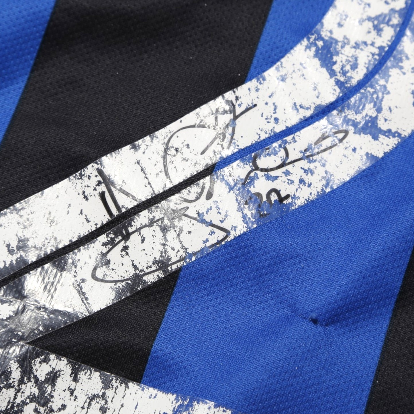 Close-up of Atalanta shirt fabric showing condition detail