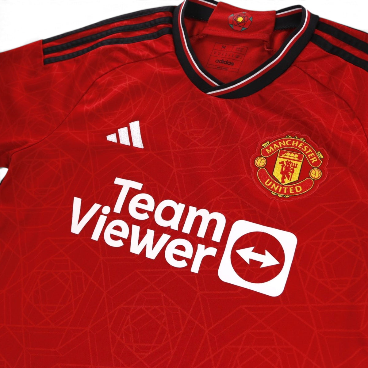 Collar and neck label detail showing adidas branding and size M