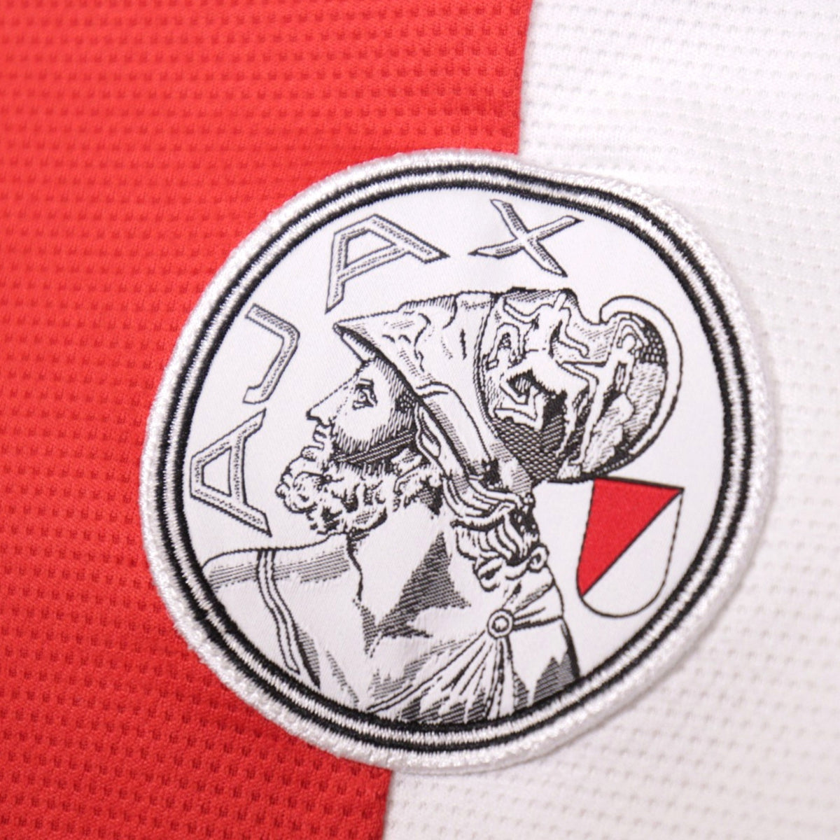 Close-up of Ajax crest detail on 2021/22 home shirt