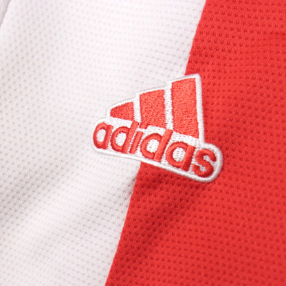Close-up of adidas logo on 2021/22 Ajax home shirt