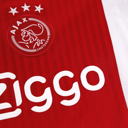 Close-up of the Ajax crest and Ziggo sponsor on the chest