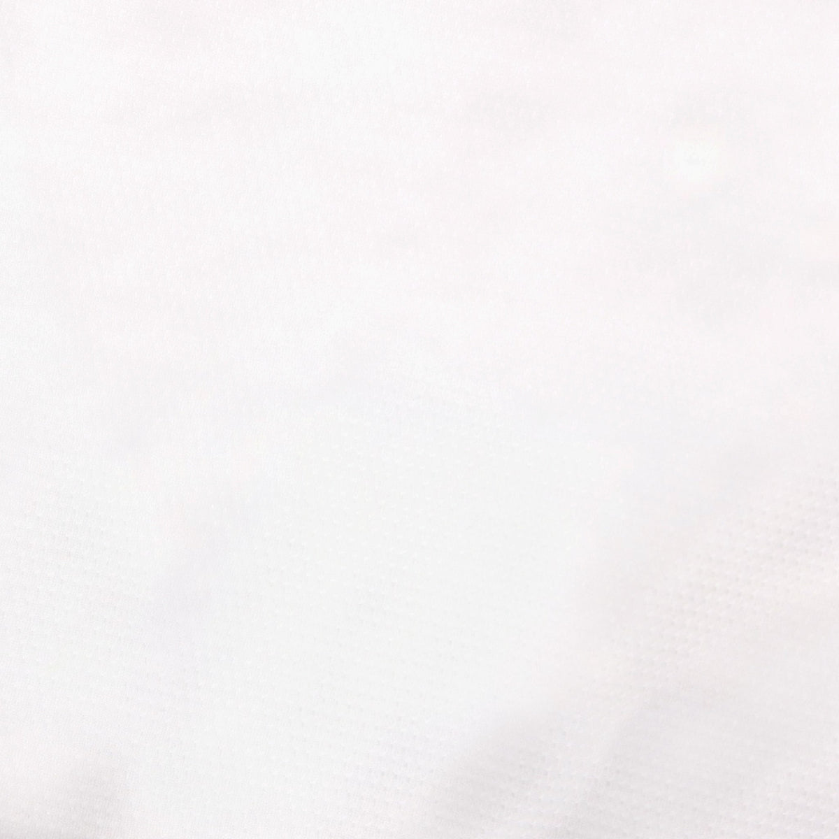Close-up of white fabric showing shirt condition
