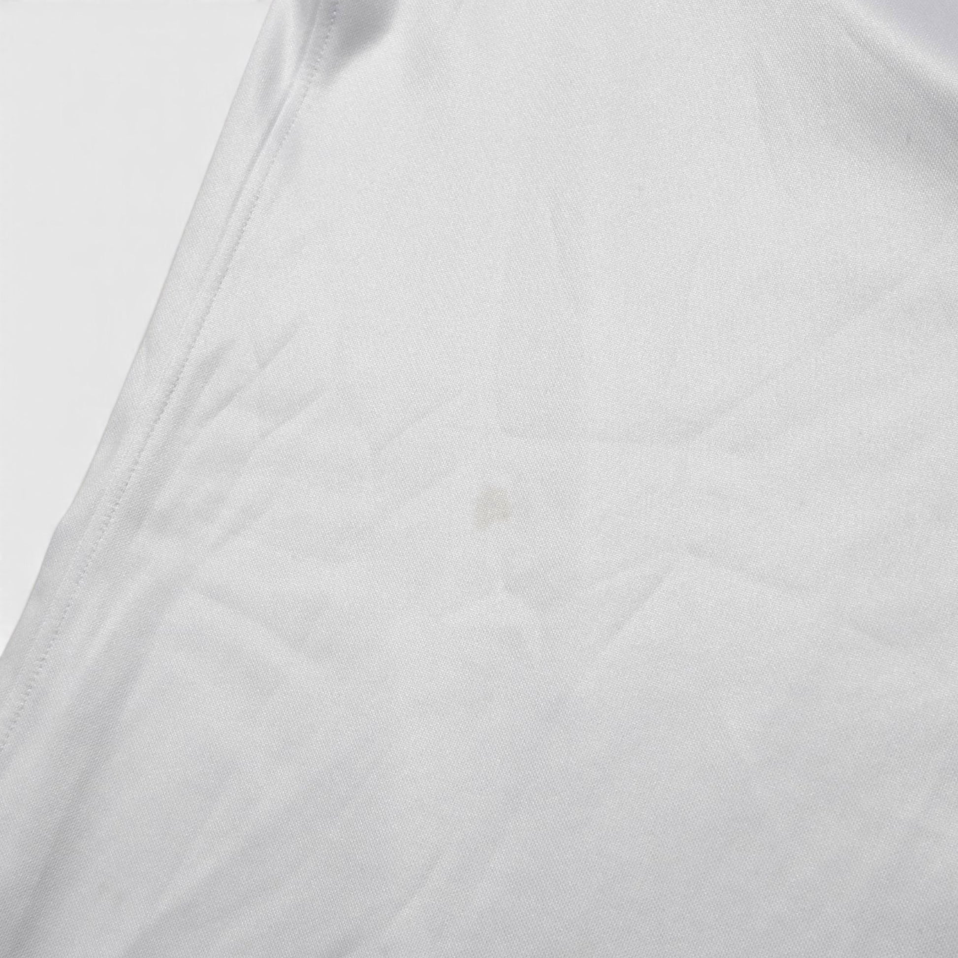 Close-up of fabric on 2022/23 England home shirt showing small mark
