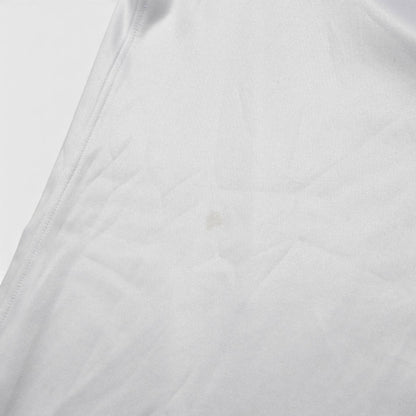 Close-up of fabric on 2022/23 England home shirt showing small mark