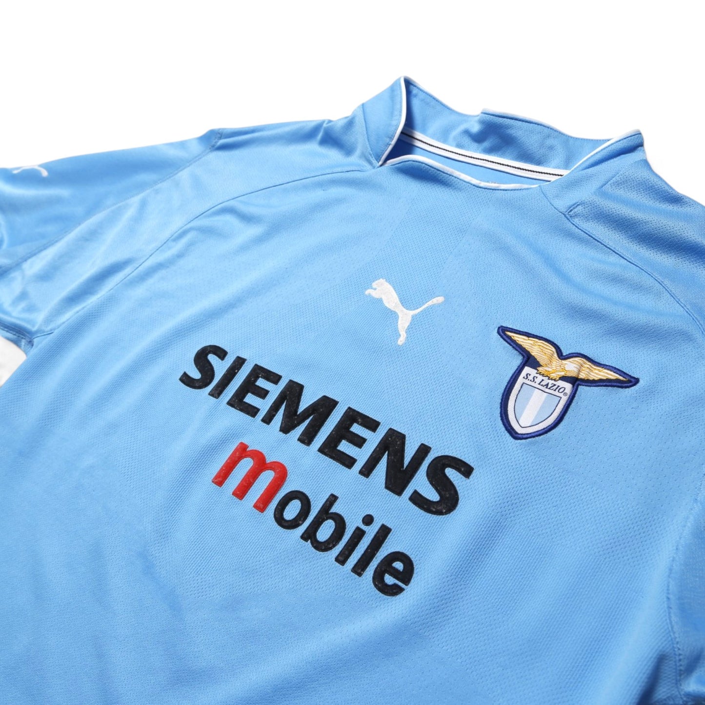 Close-up of Lazio 2002/03 home shirt chest crest, Puma logo and Siemens Mobile sponsor print