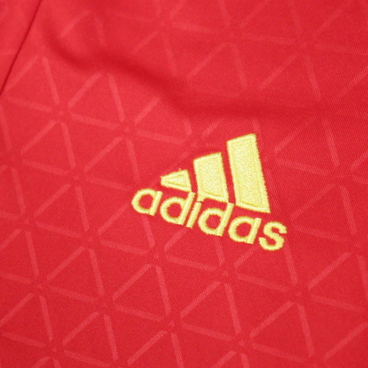 Close-up of the embroidered adidas logo on the 2016/17 Spain home shirt