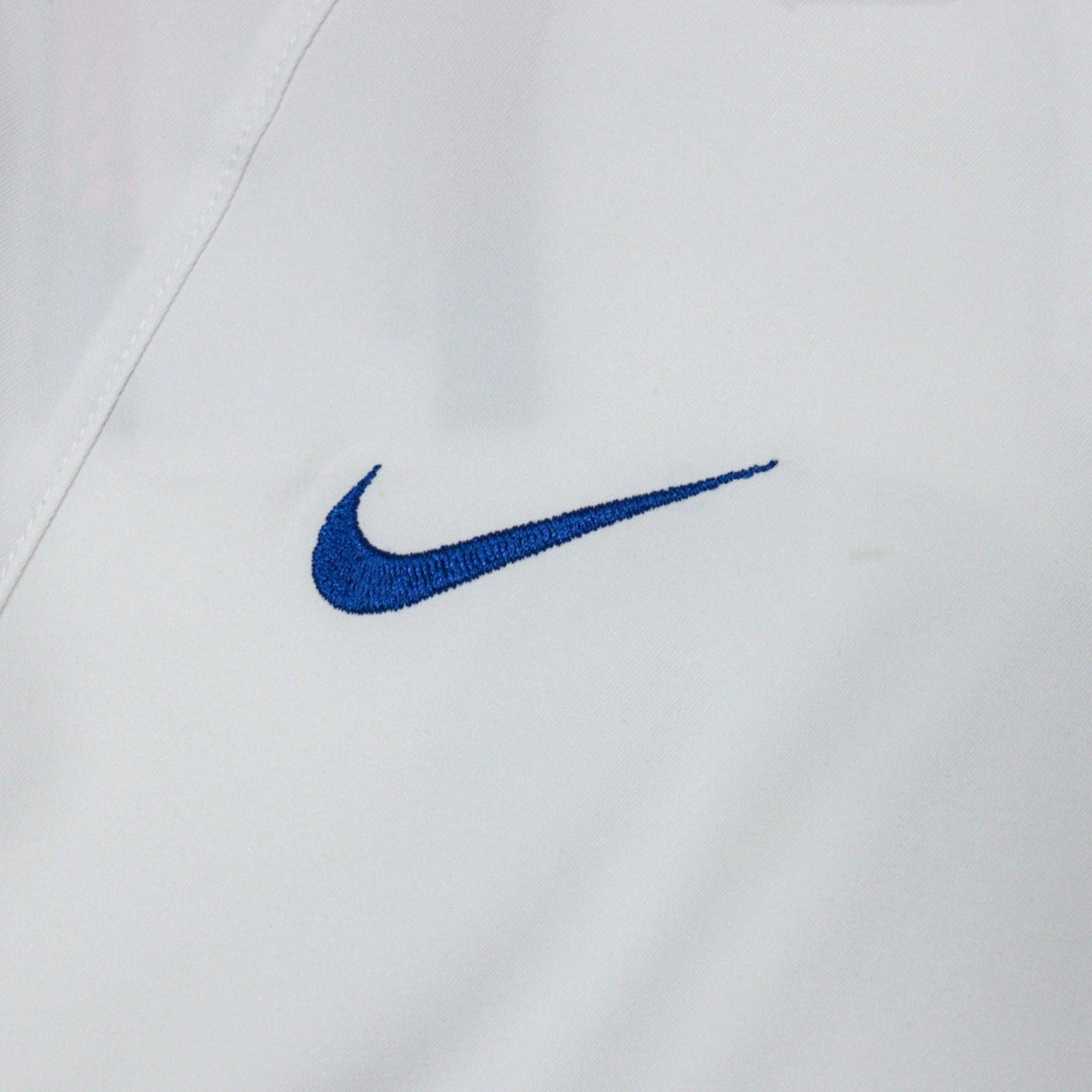 Close-up of the Nike swoosh on the chest