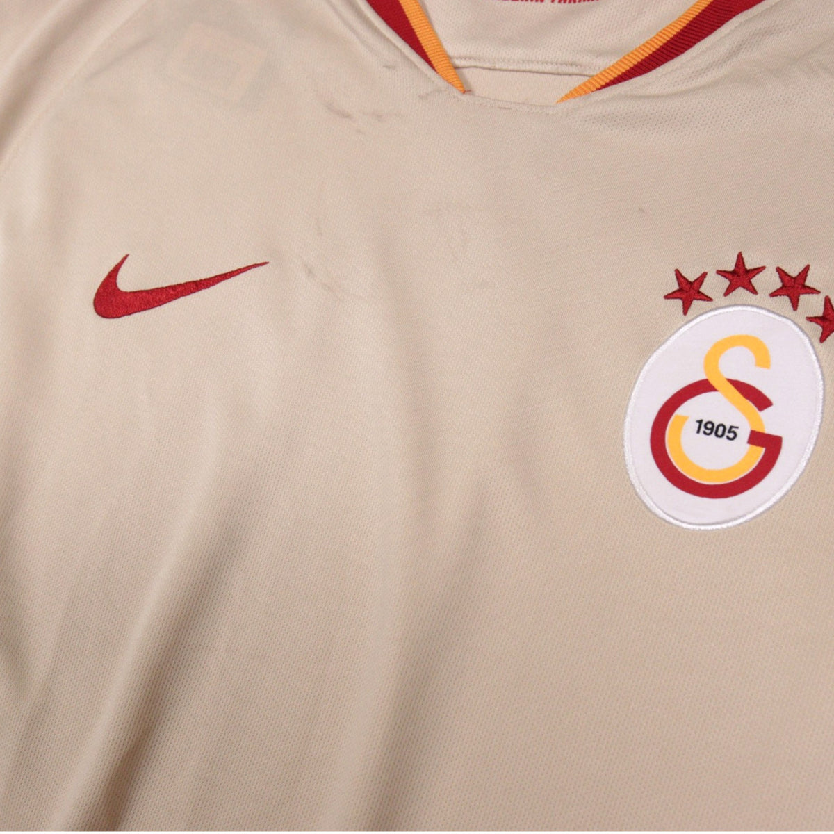 Close-up of Galatasaray crest and Nike swoosh on the front of the shirt