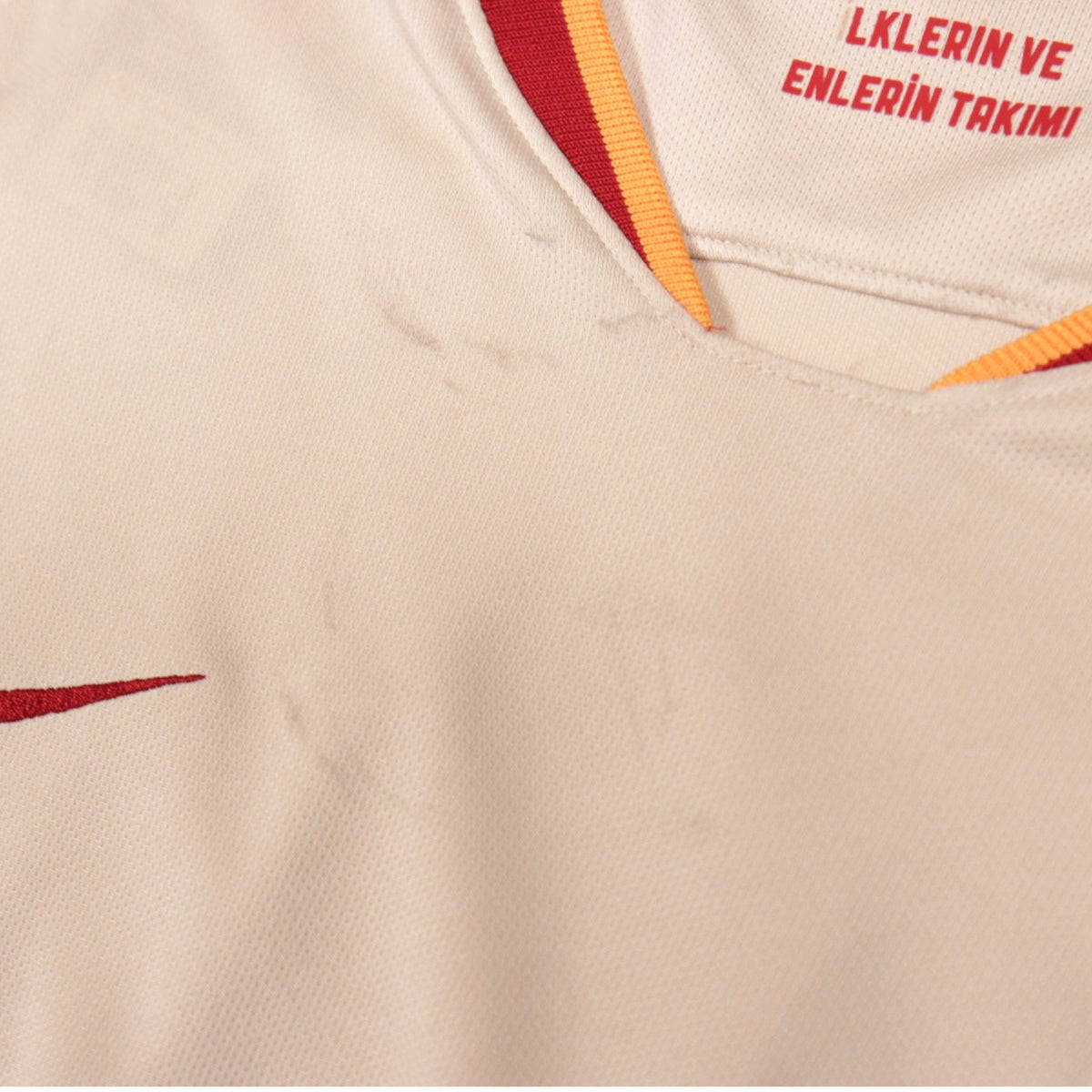 Close-up of the collar area showing faint marks on the front of the shirt