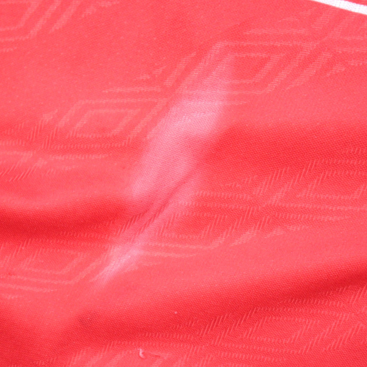 Close-up of the fabric texture on the Nottingham Forest 1994/96 home shirt