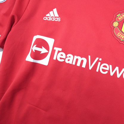 Close-up of adidas logo and TeamViewer sponsor on the chest