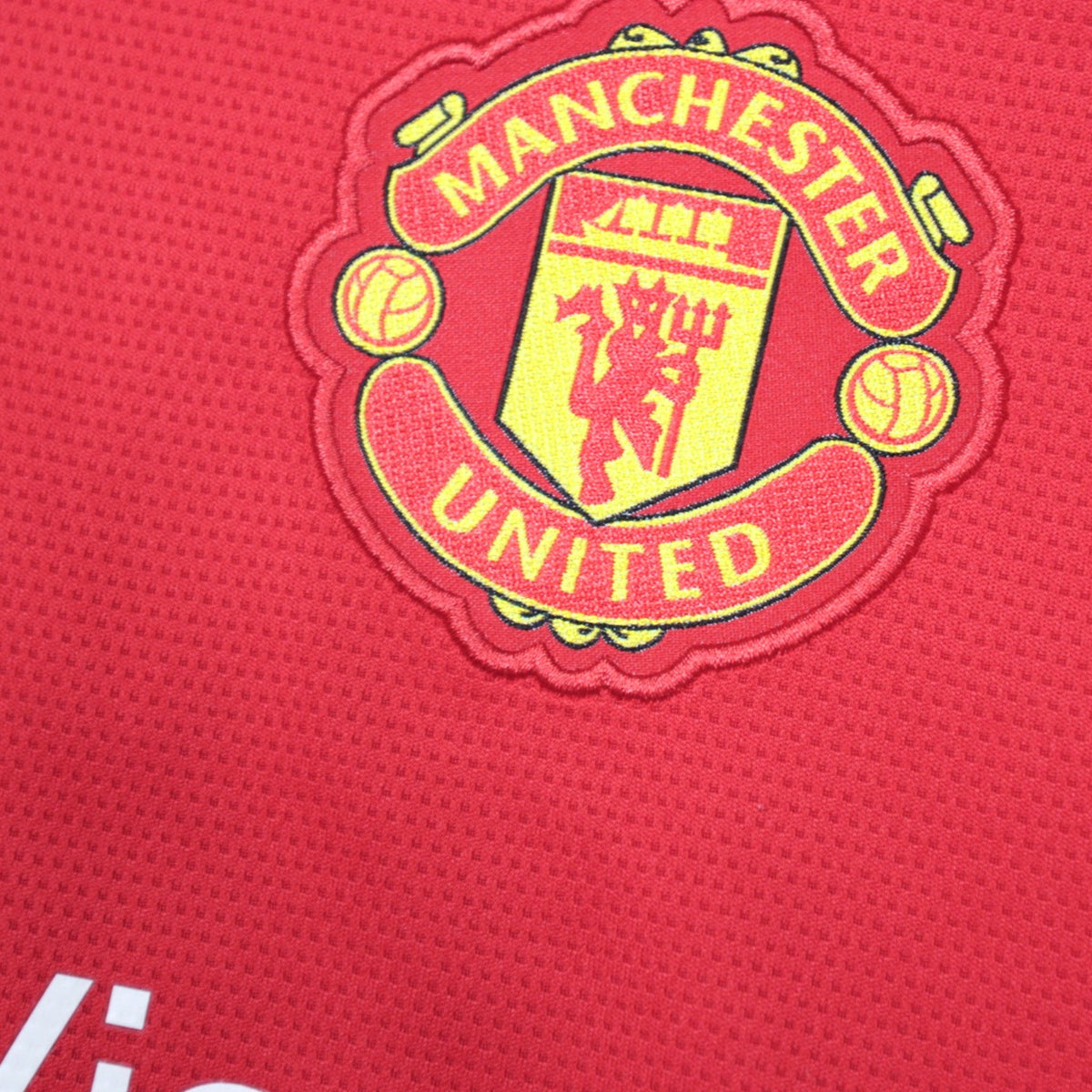 Close-up of embroidered Manchester United crest