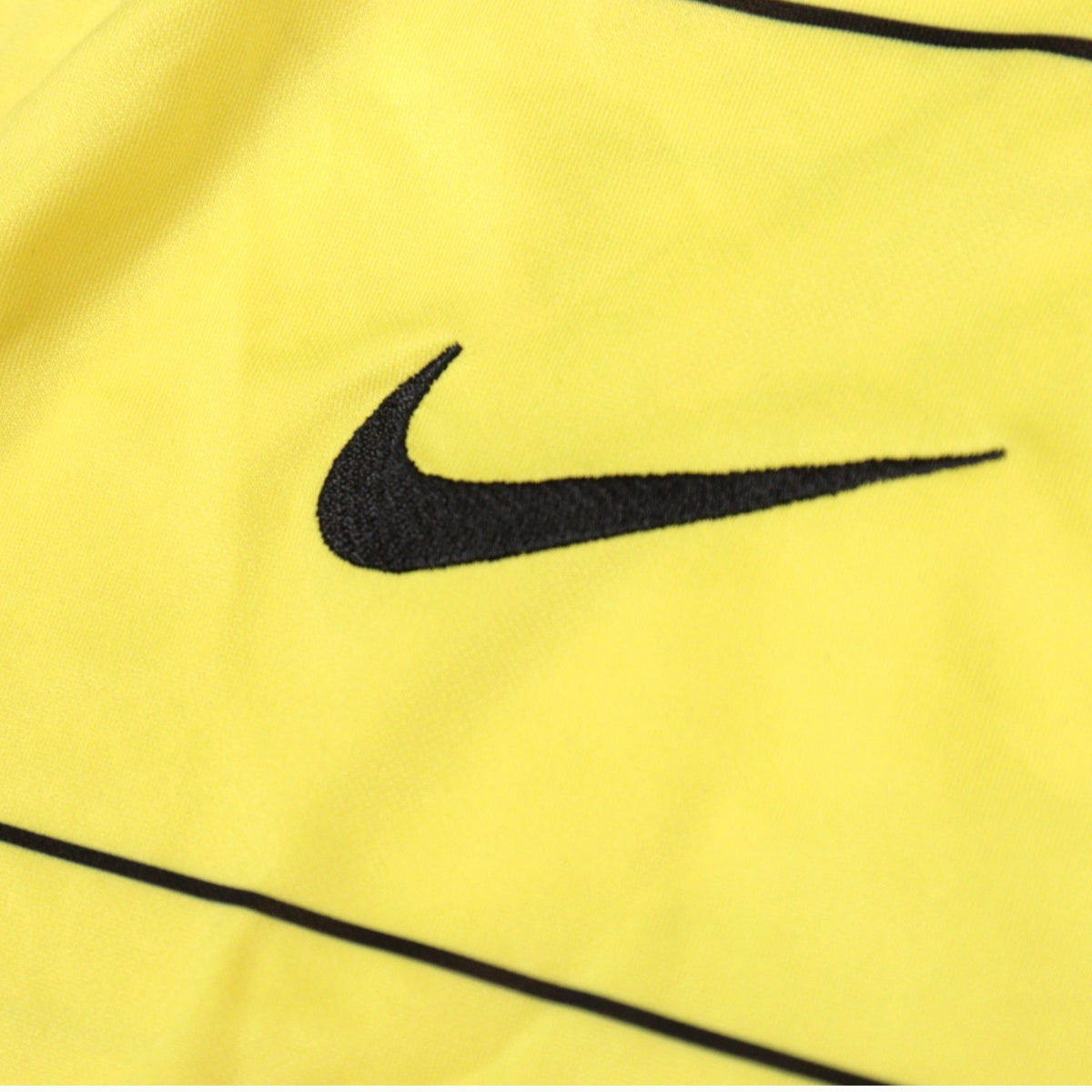Close-up of the Nike swoosh embroidery on the 2021/22 Chelsea away shirt