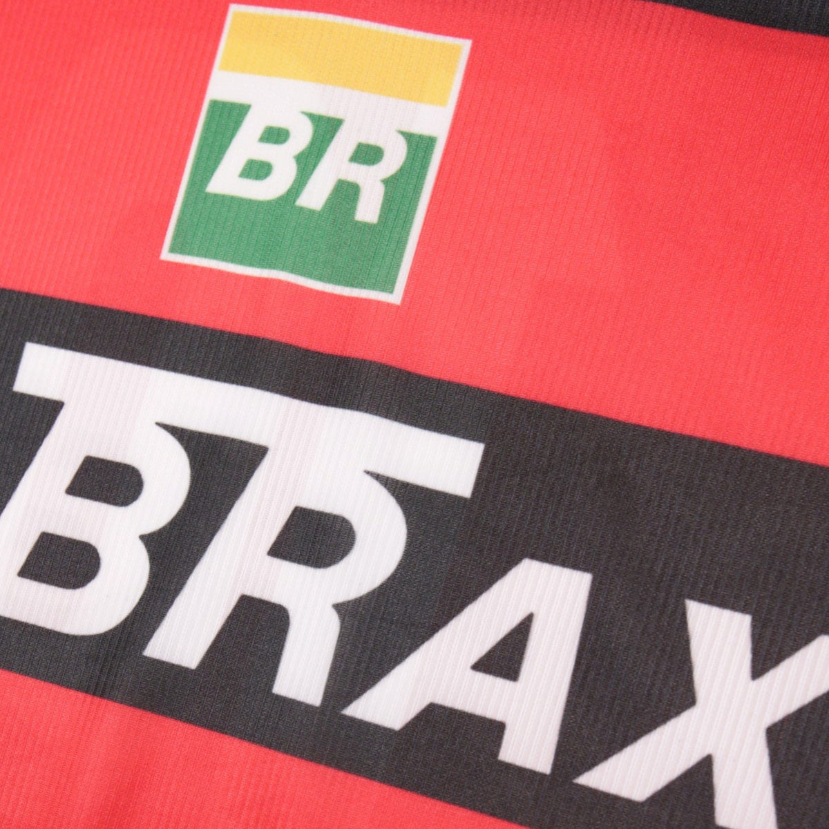 Close-up of BR logo and Lubrax sponsor print on Flamengo shirt