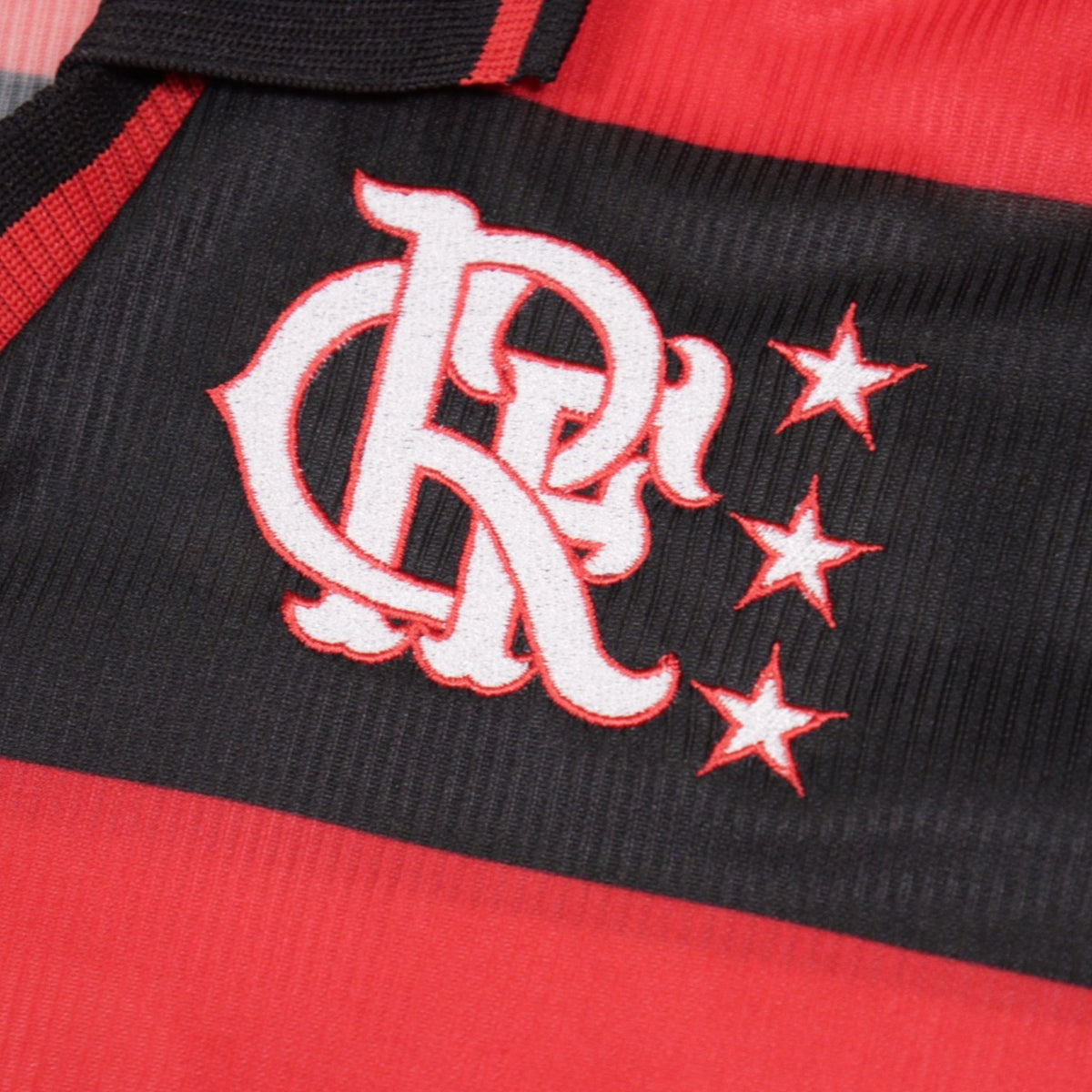 Close-up of Flamengo crest with three stars on the shirt