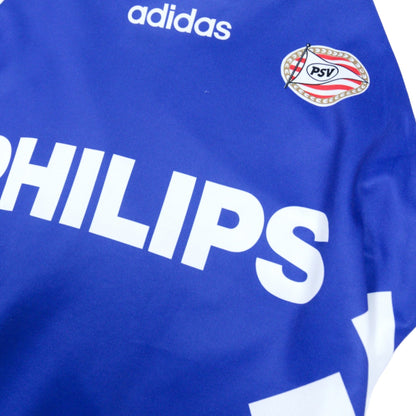 Close-up of the adidas logo, PSV crest and Philips sponsor on the chest