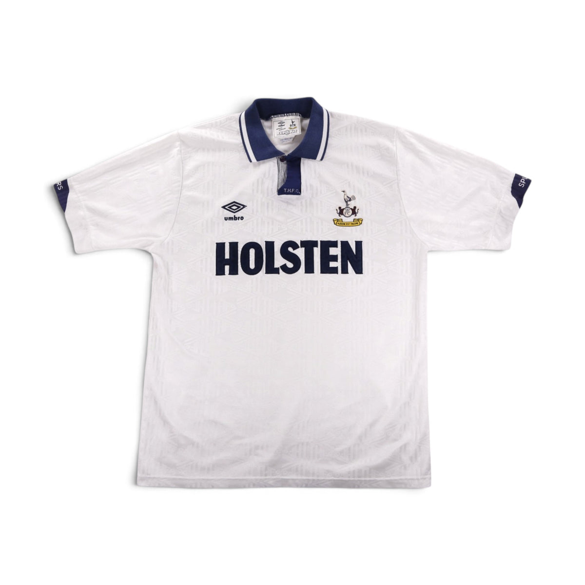Back view of a white Tottenham Hotspur home shirt with navy collar and cuffs