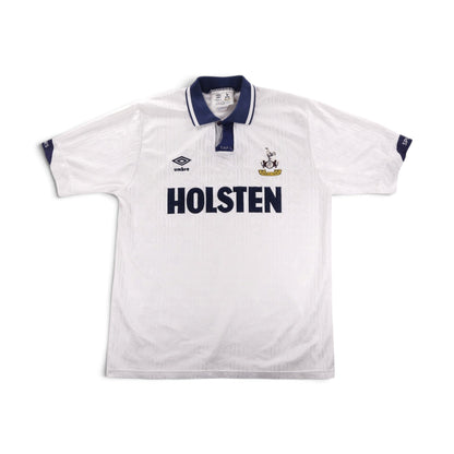 Back view of a white Tottenham Hotspur home shirt with navy collar and cuffs