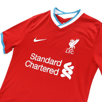 Close-up of Liverpool 2020/21 home shirt chest crest, Nike swoosh and sponsor print
