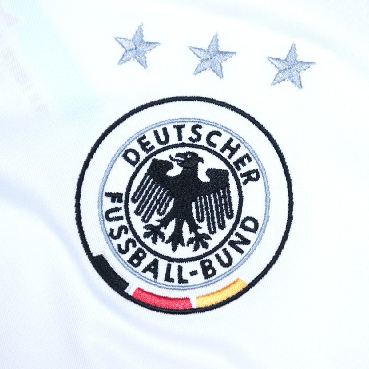 Close-up of the DFB crest with three stars above it on the chest