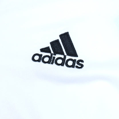 Close-up of the adidas logo embroidered on the chest