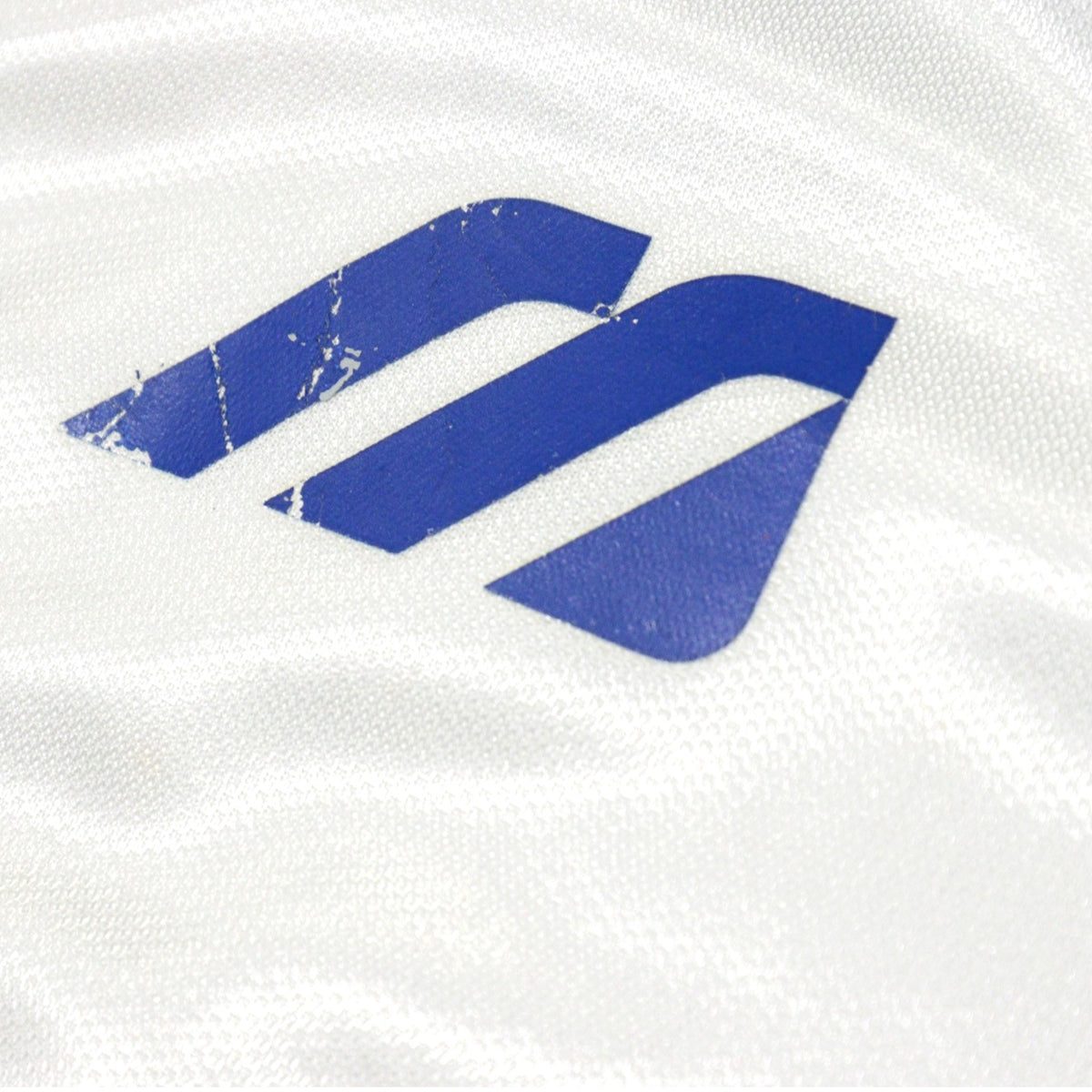 Close-up of the Mizuno logo printed on the chest